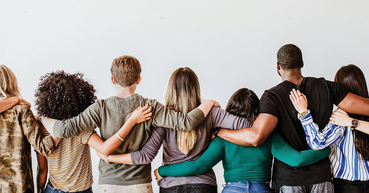 Today's daily devotional Bible verse: James 2:1 Believers in our glorious Lord Jesus Christ must not show favoritism. | A diverse group of people with arms linked.