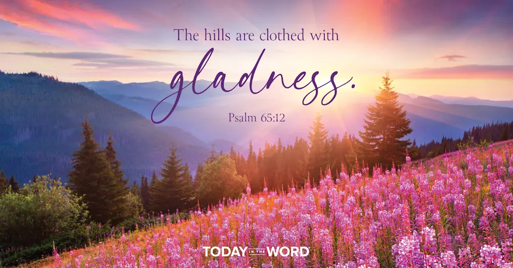 Today's daily devotional Bible verse: Psalm 65:12 The hills are clothed with gladness. | pink flowered covered hills in the mountains.