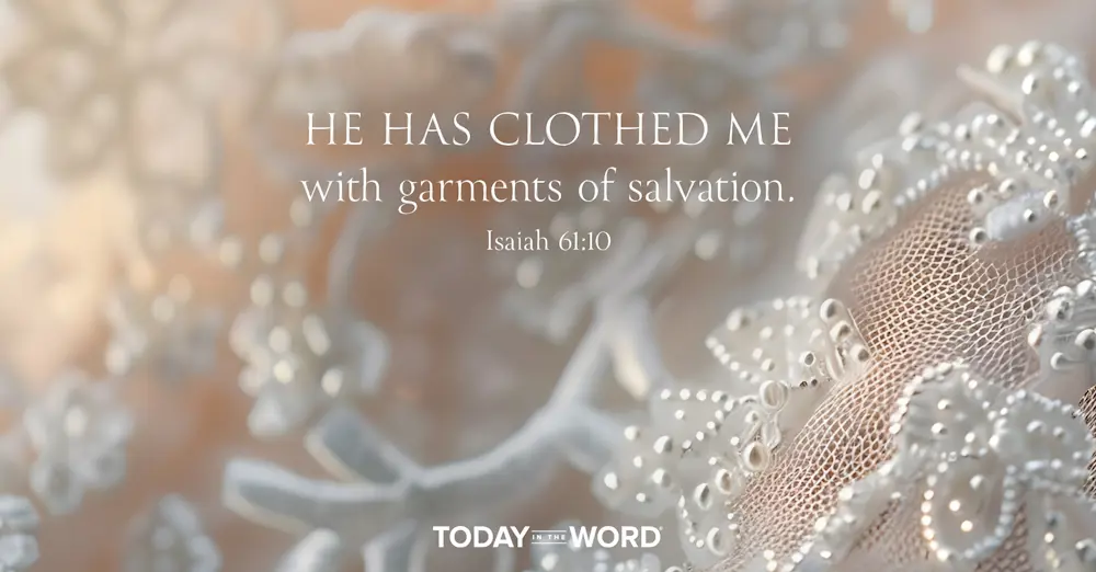 Today's daily devotional Bible verse: Isaiah 61:10 He has clothed me with garments of salvation. | A wedding dress