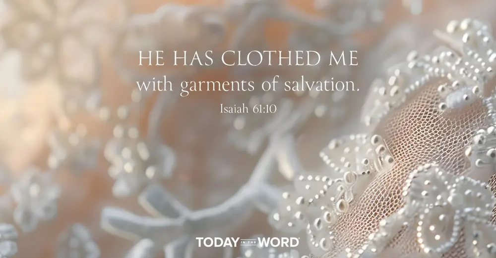 Today's daily devotional Bible verse: Isaiah 61:10 He has clothed me with garments of salvation. | A wedding dress